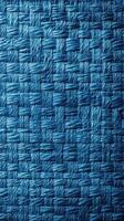 Textured woven blue fabric with intricate patterns showcasing craftsmanship in textile design photo