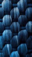 Intricate pattern of woven blue threads showcasing various shades and textures in a close-up view photo