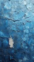 Textured blue wall with peeling paint showcasing different shades in a cozy indoor setting photo