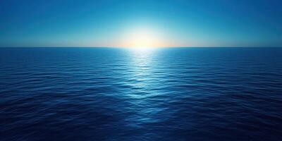 Vibrant sunrise over calm ocean waters reflecting soft hues of blue and gold in early morning photo