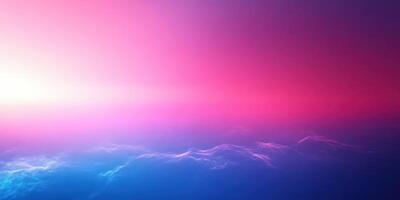Colorful sunrise over calm ocean waves with vibrant hues of pink and blue lighting up the sky photo