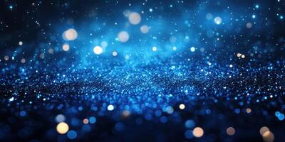 Glittering blue particles create a mesmerizing effect in a dark backdrop during the evening photo