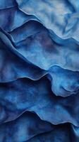 Textured layers of deep blue fabric create a stunning visual display of movement and color in an artistic composition photo