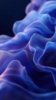 Elegant blue and purple fabric flowing gracefully in delicate waves under soft lighting photo