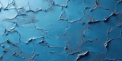 Textured blue wall with cracks and uneven surface showcasing a unique design and color depth in natural light photo