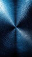 Textured metallic surface with a blue gradient creating a mesmerizing visual effect in a circular pattern photo