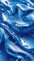 Waves of vibrant blue liquid with bubbles creating mesmerizing patterns and reflections photo