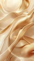 Elegant golden silk fabric draped softly on a surface creating smooth flowing waves and textures in warm lighting photo