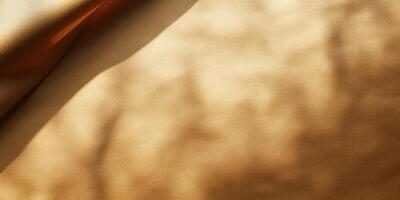 Soft texture of golden fabric illuminated by natural light casts gentle shadows in an elegant composition photo