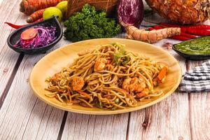 A plate of food on a table with a bunch of vegetables photo