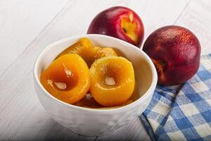 A bowl of fruit on a table photo