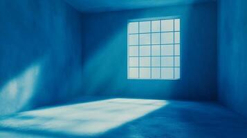 A monochromatic azure room is illuminated by light streaming through a paneled window. The walls are painted a deep blue. Serene and surreal. photo