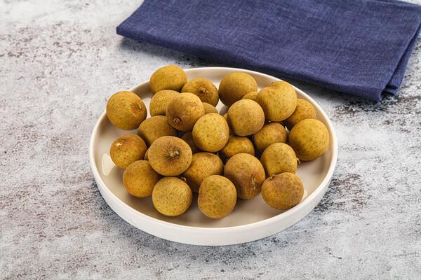 A bowl of kiwis on a table