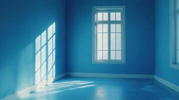 Serene blue room with sunlight streaming through windows, creating patterns on the wall and floor. Tranquil interior scene, quiet and peaceful. photo