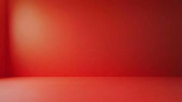 The room is a large, empty space with a red wall. The walls are bare and there is no furniture or decoration. The room has a minimalist feel to it, with the red wall serving as the only focal point photo