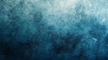 Deep blue textured background with a gradient effect, perfect for creating a moody and atmospheric design photo