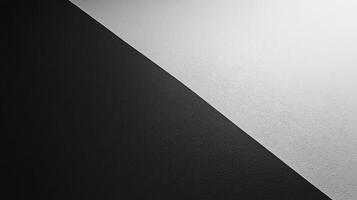 Textured background split by a diagonal line separating black and white colors photo