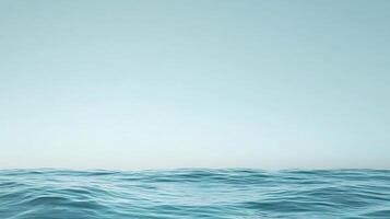 Blue ocean with no land in the background. The water is calm and peaceful. The sky is clear and bright, with no clouds in sight. The scene is serene and tranquil, with the ocean as the main focus photo