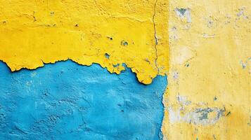 Weathered wall with layers of blue and yellow paint, creating a textured and visually striking surface, signs of aging and exposure. photo