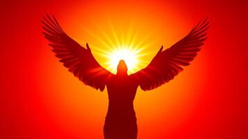 Silhouette soars with wings spread against a fiery sunset, symbolizing freedom, hope, and aspiration in a vibrant display of color. photo
