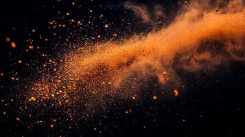 Abstract image of powder explosion, with golden dust particles in motion against a dark background, creating a dynamic visual display. photo
