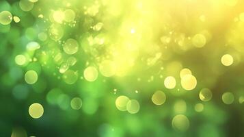 Abstract art of a vibrant yellow and green nature scene with out-of-focus light circles resembling sparkling dewdrops in early spring photo