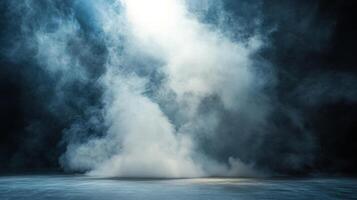 Abstract image featuring a ground level shot of rising smoke or vapor illuminated from above against a dark backdrop for a dramatic ambiance. photo
