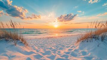 Tranquil beach scene at sunrise, featuring soft sand, gentle waves, and warm light breaking through the clouds on the horizon. photo