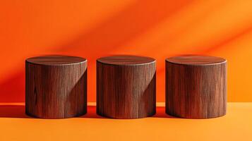 Three rustic wooden cylinder podiums against an orange background. Ideal for showcasing products in a minimalist, natural setting. photo