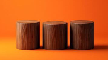 Three wooden cylindrical podiums are lined up against a solid orange background, providing a clean and minimalistic presentation space. photo