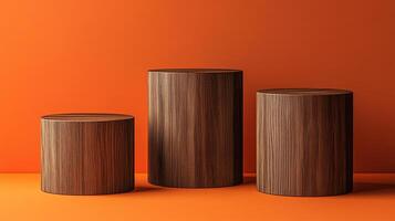 Three minimalist wood cylinders on a vibrant orange background create a modern and organic display platform for product showcasing. photo