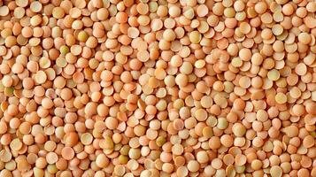 A textured close-up shot displaying the natural patterns and earthy tones of lentils filling the frame, showcasing their simple beauty. photo