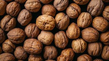 A textured display of walnuts showcasing their natural beauty and intricate shell patterns. These are rich in healthy fats and nutrients. photo