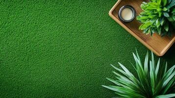 An eye-level shot of a green surface with vegetation arranged around a wooden tray holding small jar, set on vibrant green backdrop. photo