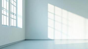 Bright, empty room interior with light streaming in. The walls are white, and there is a window that lets in a lot of natural light. photo