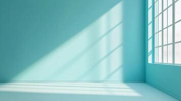 Aquamarine room filled with sunlight streaming through a window, casting shadows on the wall and floor. Empty space with potential. photo