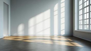 Bright sunlight streams through the window of an empty room, illuminating the wooden floor. A minimalist, inviting interior space. photo