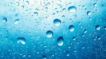 Close-up of water droplets on a surface, creating a refreshing, abstract texture with a clear, cool aquatic tone. photo