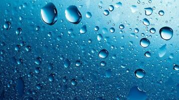 A macro shot showcases water droplets on a blue metallic surface, capturing light reflection and textures in this natural, watery spectacle. photo