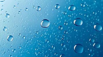 Water droplets on a smooth surface create a clean, refreshing abstract pattern with varied sizes and depth, reflecting light. photo