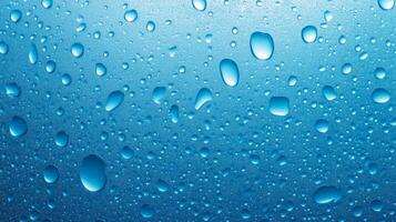 Captivating close-up of water droplets glistening on a smooth, cool surface. An array of shapes and sizes creates a calming effect. photo