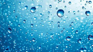 A captivating close-up of water droplets clinging to a surface, creating a mesmerizing pattern against a soft blue background. photo