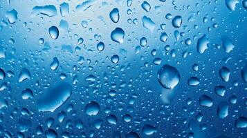 An artistic macro shot of water droplets cling to a glossy, blue surface, highlighting the beauty of nature's patterns and reflections. photo