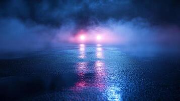 Headlights glow through dense fog on a wet road, reflections shimmer in the darkness, creating an eerie and mysterious scene. photo