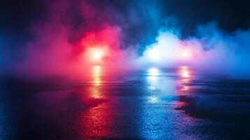 Illuminated vapor above a wet surface. The fog is illuminated with red and blue lights, creating a vibrant and otherworldly scene. photo