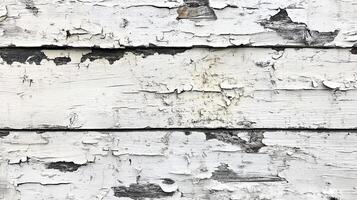 Distressed paint on weathered wooden boards showcases age and texture. Peeling paint creates an abstract pattern. photo