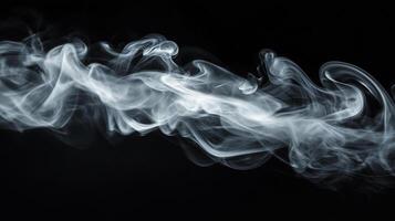 Wisp of smoke gracefully drifts and swirls across a stark black backdrop, creating an elegant and ethereal visual effect. photo