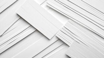 White rectangles create an overlapping, layered abstract design with minimal shadows on a solid surface. Neutral and clean aesthetic. photo