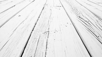 White washed wooden floorboards show their age and texture in sharp black and white, creating a textured perspective shot. photo