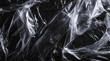 Abstract translucent polymer film on stark black background. Visual effect of depth and dimension. Modern, industrial and minimalistic. photo